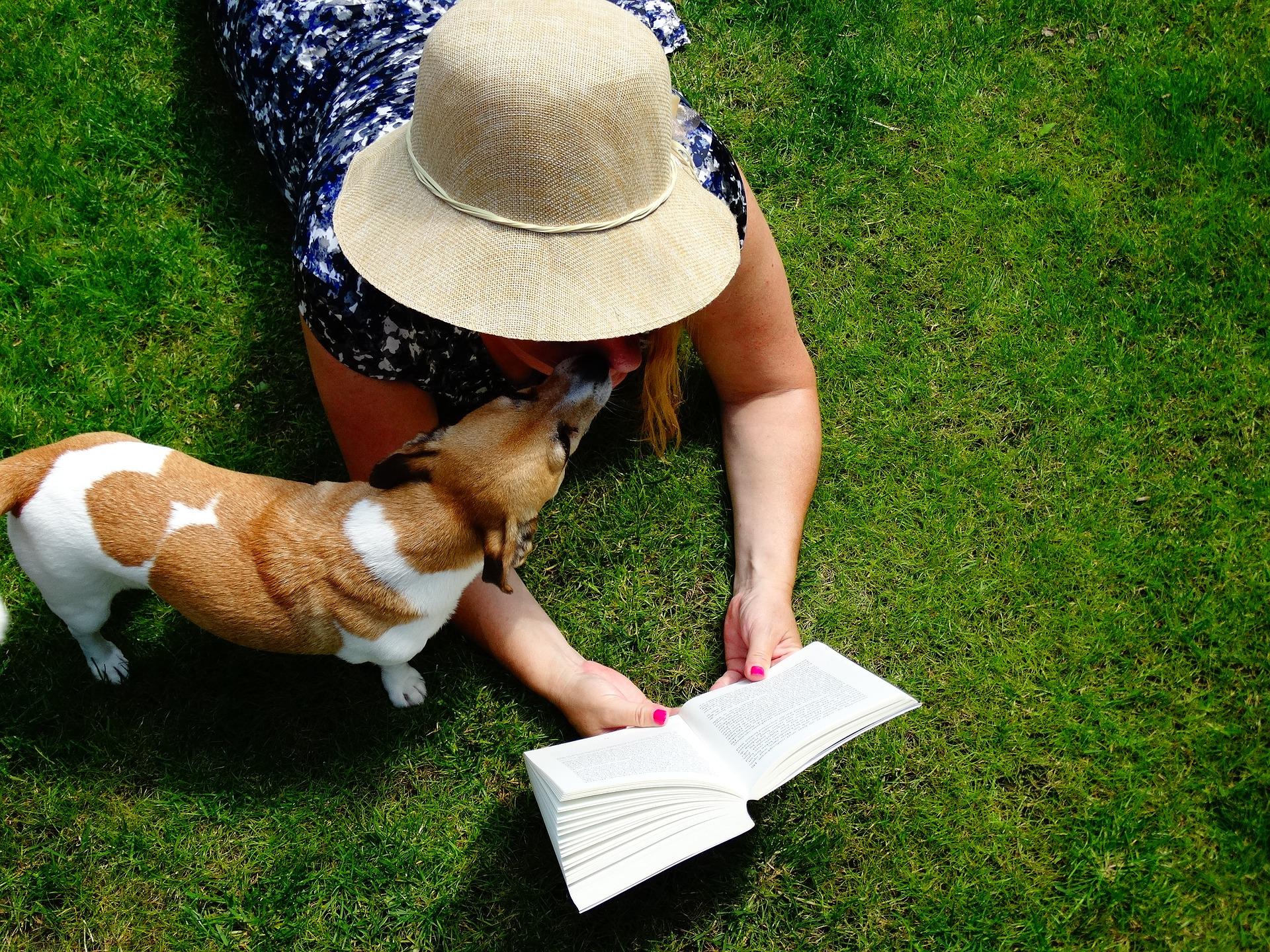 Woman with dog and book.